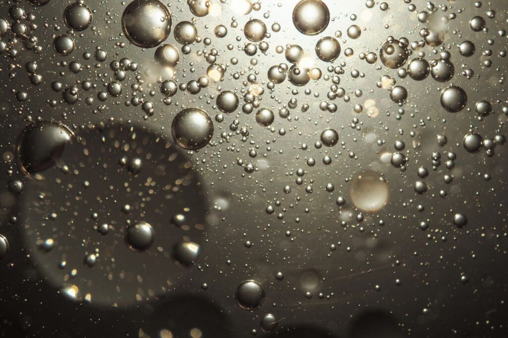 pexels photo 7011873 Abstract image of oil and water droplets creating unique textures and reflections.
